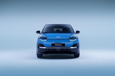 full front view of All new Nissan Micra in a well lit studio with only led signature headlamps  on