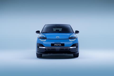 full front view of All new Nissan Micra in a well lit studio with only led signature headlamps  on