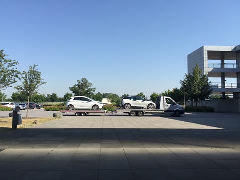 Zoe and i3 on trailer at Honda facility Germany