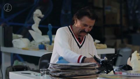 Colani at work in his trademark white – matches the plaster dust